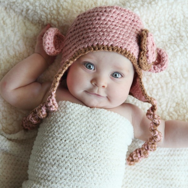 adorable baby girl in monkey hat