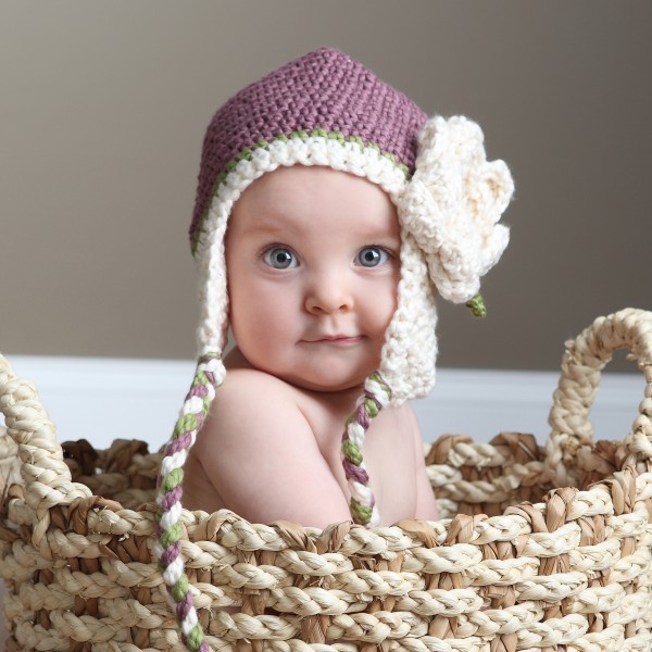 cute baby wearing purple crochet hat