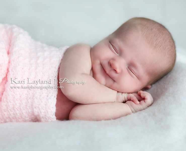 smiling newborn baby girl