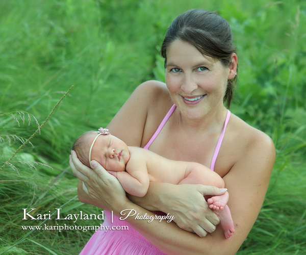 Mother and newborn baby outdoors