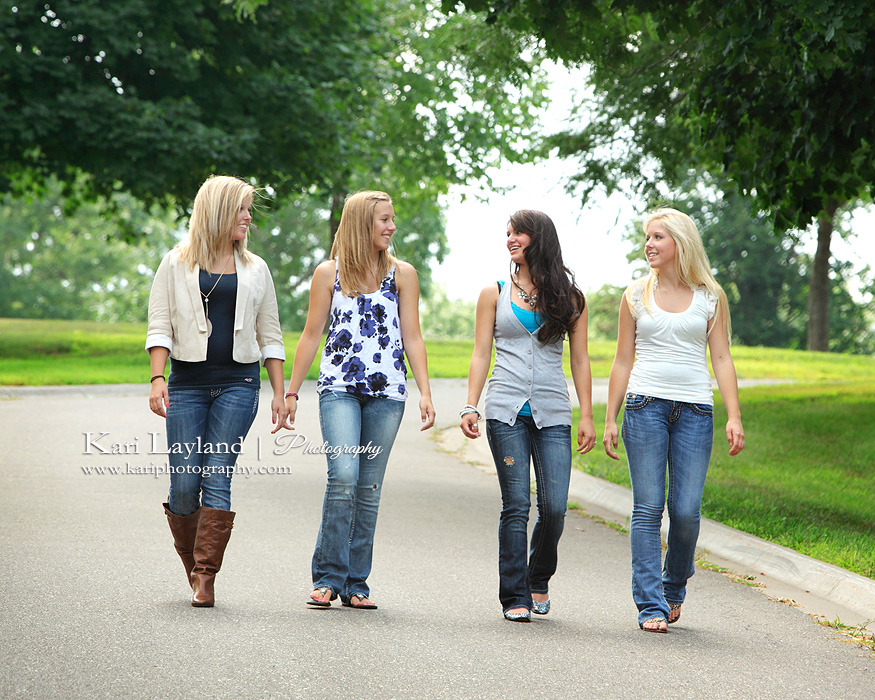 Girls walking, candid portrait of friends.