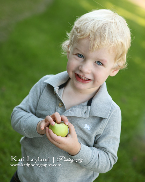Child Holding and Apple