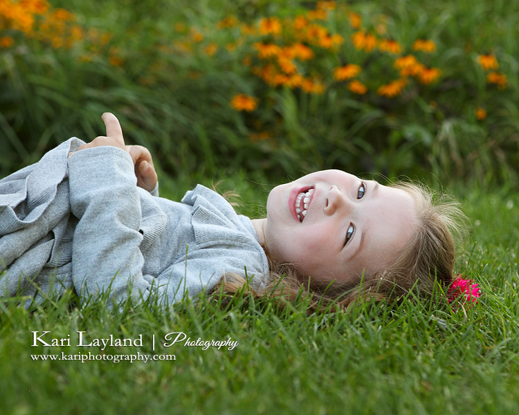 Laughing little girl portrait.  Photography by Kari Layland in Minnesota.