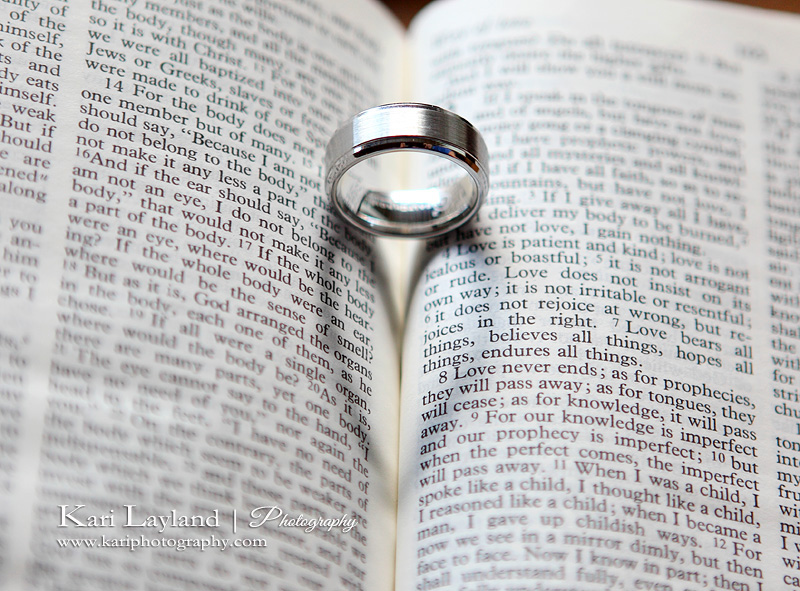 Groom's ring casting a heart shadow on the bible.